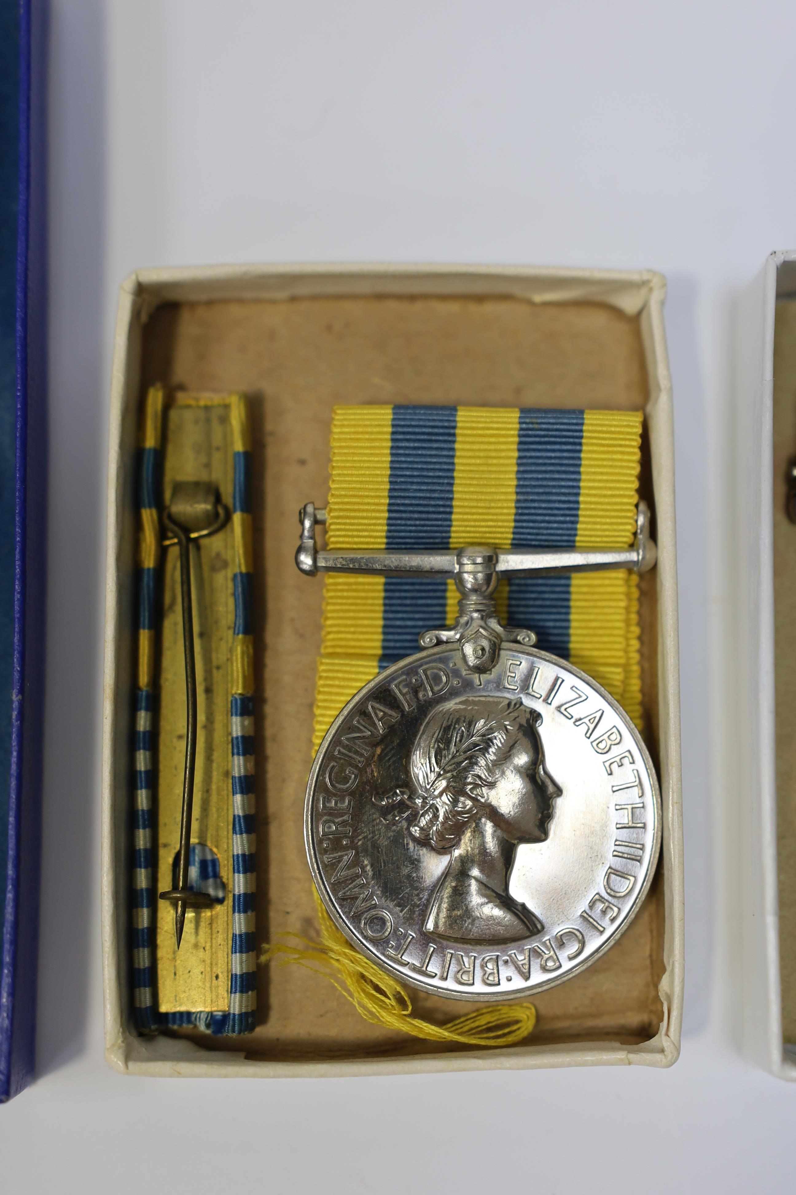 An ERII Operational Service Medal for Afghanistan awarded to Sgt. A.J. Pugsley RAMC (R), together with a Korea medal pair awarded to Sigmn. A.G. Lickman R.Sigs., all in separate issue boxes. Condition - fair to good